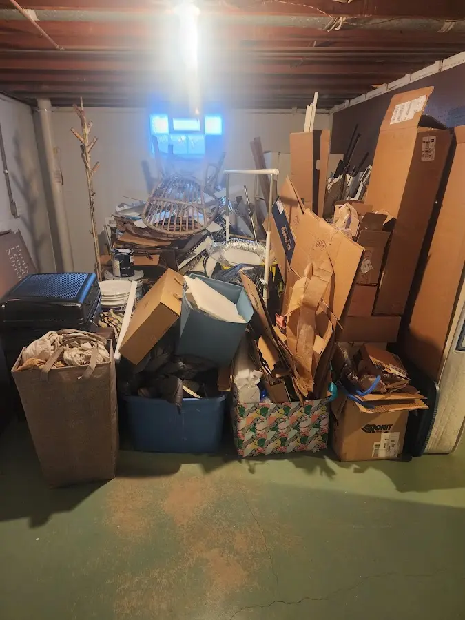 Roll-off dumpster container at job site for 2 Yard Dumpster Rental in Whispering Pines